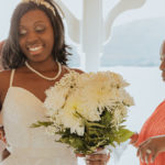 close up of the bride smiling while mother of the bride looks on. Elopement at Plum Point Park