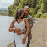 closeup of the groom holding the bride around her waist. Elopement at Plum Point Park