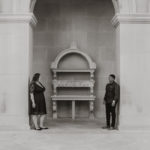 black and white photo of brides to be standing under an archway.