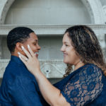 close up of brides to be smiling at each other.