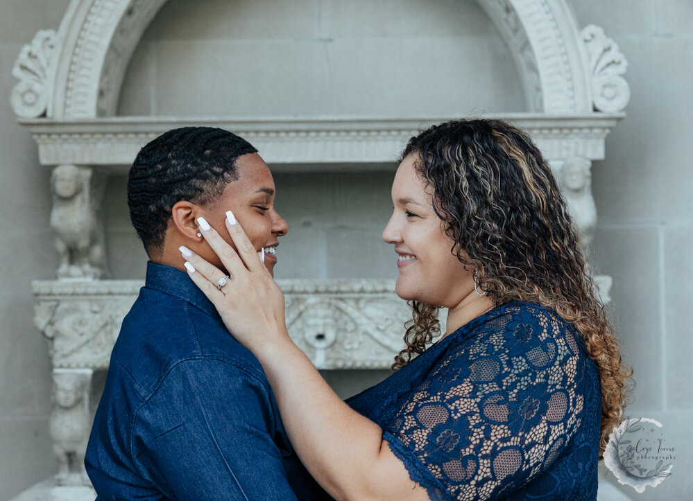 close up of brides to be smiling at each other.