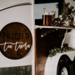 closeup shot of the tavern logo which reads 'Nuzzi's Tavern'. New Wave of Mobile Wedding Services