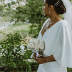 a side view shot of the bride and the details of her dress and bouquet.
