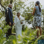 a photo of the bride and groom and minister. Small Wedding in NYC