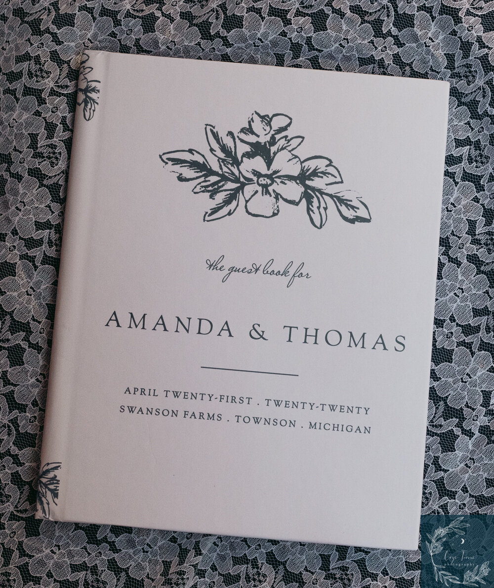 a close up photo of a wedding guestbook from the company Basic Invite.