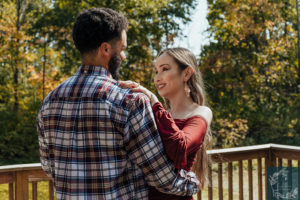 newly engaged couple shares a dance.