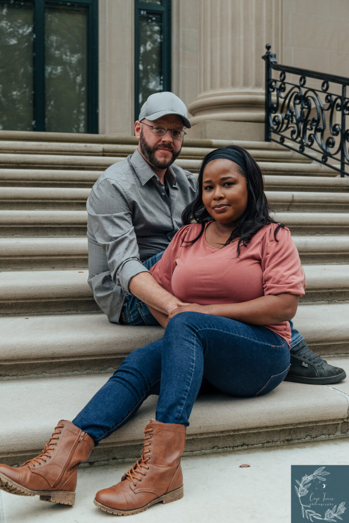 newly engaged couple posing for photos at Vanderbilt Mansion.