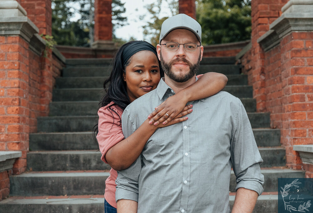 Newly Engaged couple poses at steps in Italian GArdens in Vanderbilt Mansion. Engagement Session at Vanderbilt Mansion