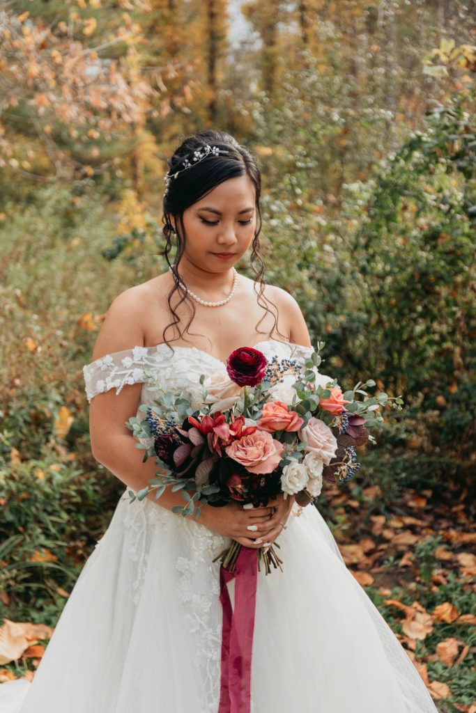 bride looking at bouquet the appel inn