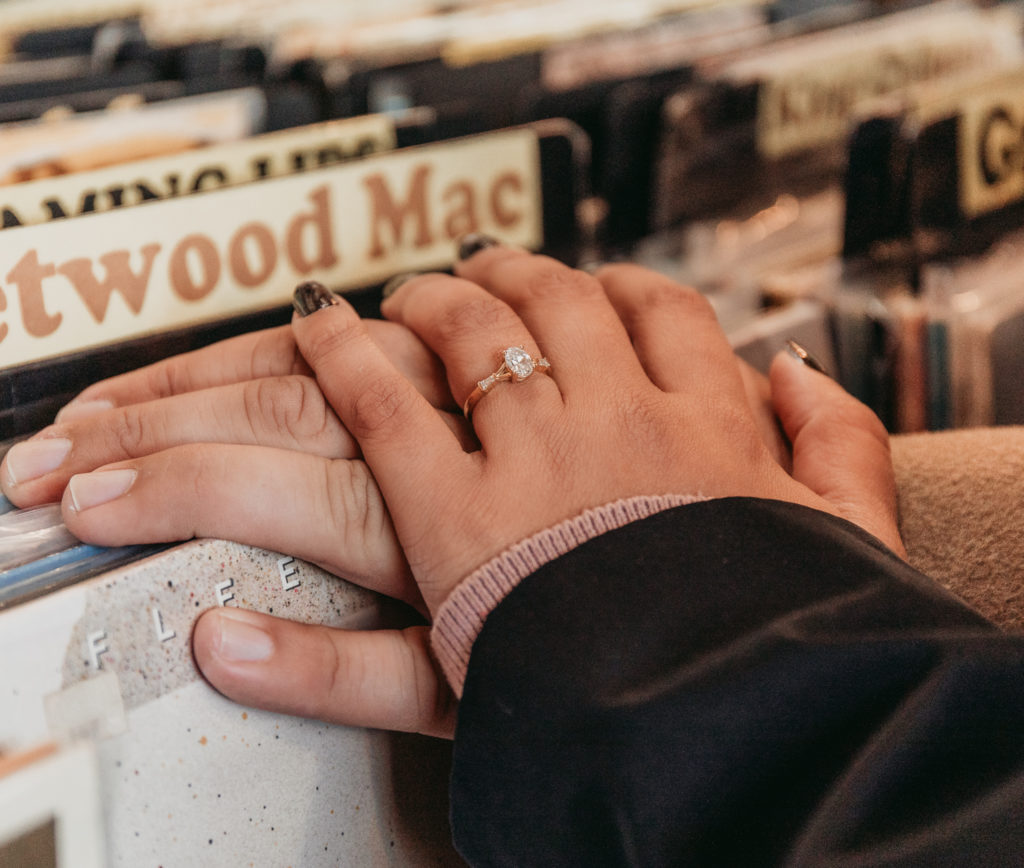 newly engaged couple rhino records kingston new york hudson valley ring shot