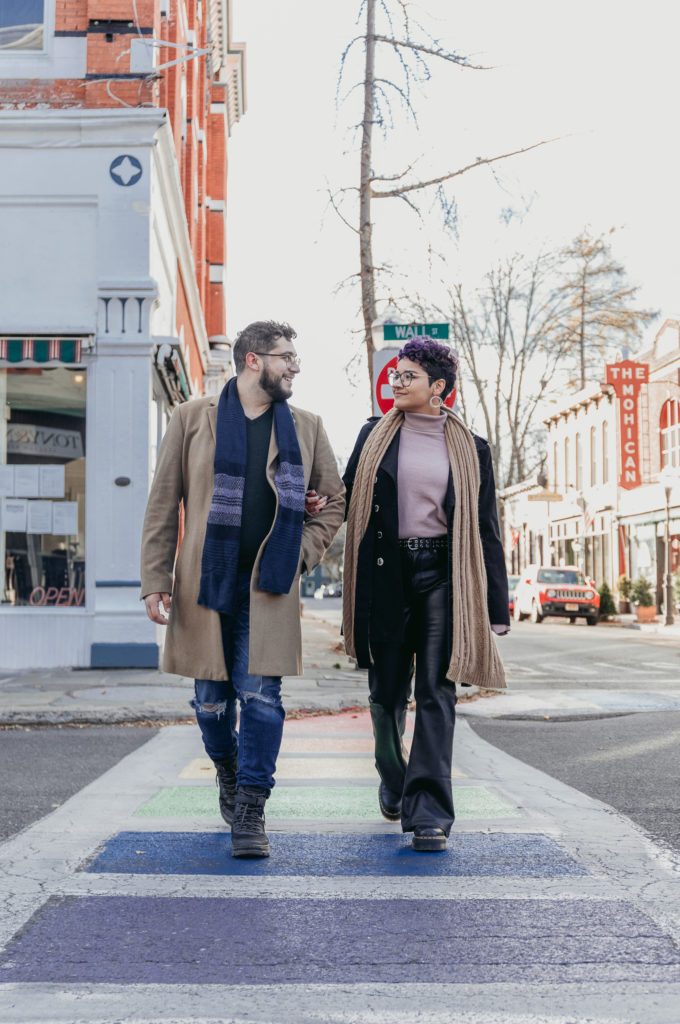 couple walking across the street in kingston new york hudson valley crys torres photography walking across street