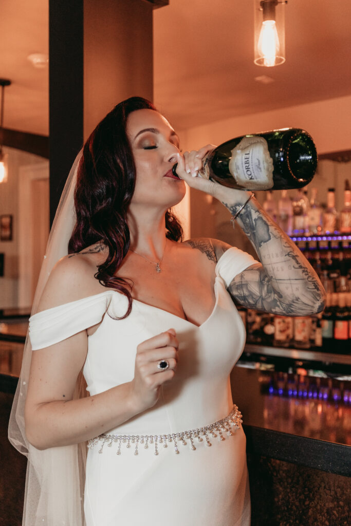 bride drinks champagne before ceremony.