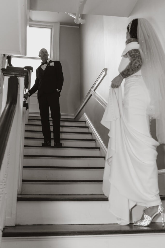 black and white photo of couple on steps