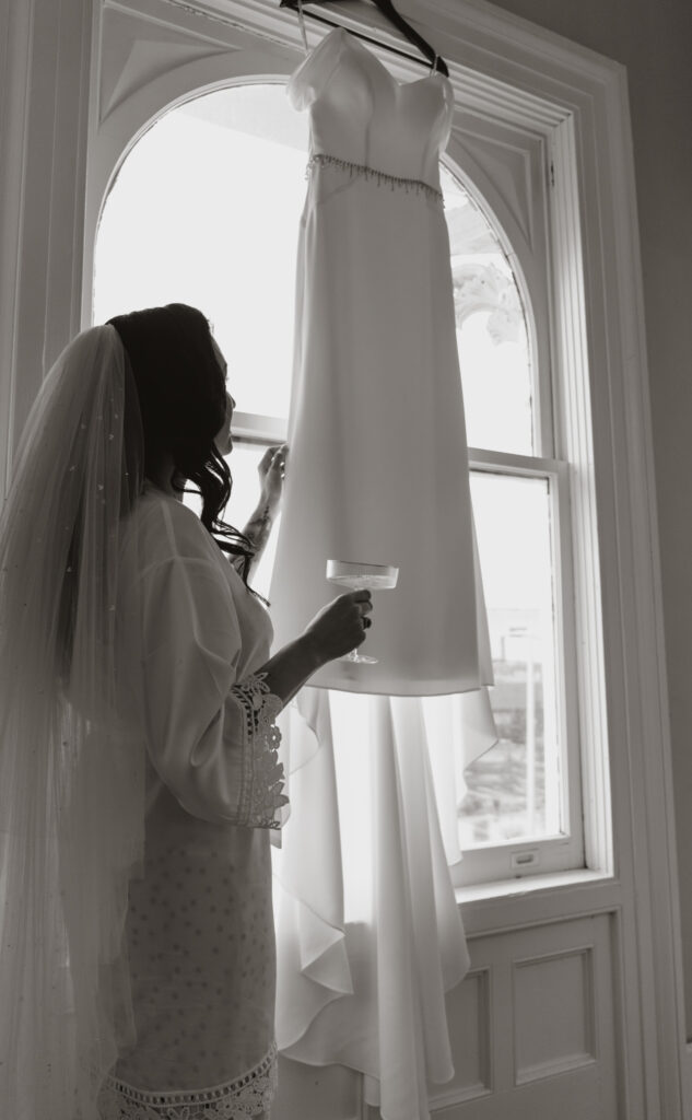 bride getting ready for wedding at revel 32 poughkeepsie new york. black and white shot.